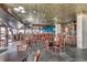 Restaurant with dark wood bar and tables at 201 74Th Ave. N # 1128, Myrtle Beach, SC 29572