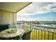 Balcony with a view of the marina, waterway, and city with comfortable seating at 2151 Bridge View Ct. # 1-702, North Myrtle Beach, SC 29582