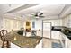 Functional kitchen design with granite counters, white appliances, and convenient bar seating at 2151 Bridge View Ct. # 1-702, North Myrtle Beach, SC 29582