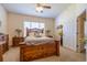 Bedroom with ceiling fan and a window that provides natural light and a door for easy access at 221 Port Smith Dr. # 6, Myrtle Beach, SC 29588