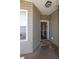 A welcoming front porch area featuring the front door, a welcome mat, and a window with blinds at 221 Port Smith Dr. # 6, Myrtle Beach, SC 29588