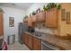 Kitchen featuring stainless steel appliances, tile backsplash, and wooden cabinets at 221 Port Smith Dr. # 6, Myrtle Beach, SC 29588