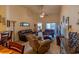Spacious living room with comfortable seating, a ceiling fan, and sliding glass doors to a balcony at 221 Port Smith Dr. # 6, Myrtle Beach, SC 29588