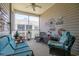 Cozy screened porch with comfortable seating, ceiling fan, and decorative accents at 221 Port Smith Dr. # 6, Myrtle Beach, SC 29588