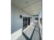Spacious balcony featuring wood-look flooring, stylish black sconces, and a bright white exterior at 2309 Seaseeker Ln., Myrtle Beach, SC 29577