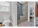 Modern bathroom showcasing a glass enclosed shower with stone flooring and blue tiling at 2309 Seaseeker Ln., Myrtle Beach, SC 29577