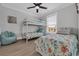 Bright bedroom features a bunk bed, twin bed, wood-look floors, and coastal themed decor at 2309 Seaseeker Ln., Myrtle Beach, SC 29577