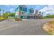 Coastal townhomes with vibrant blue accents and spacious parking at 2309 Seaseeker Ln., Myrtle Beach, SC 29577