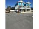 View of two new blue and white construction homes with ample parking and landscaping at 2309 Seaseeker Ln., Myrtle Beach, SC 29577