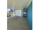 Detached one car garage with white door and modern blue siding at 2309 Seaseeker Ln., Myrtle Beach, SC 29577