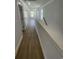 Upstairs hallway with wood floors leads to bedrooms at 2309 Seaseeker Ln., Myrtle Beach, SC 29577