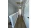 Upstairs hallway with wood floors leads to bedrooms at 2309 Seaseeker Ln., Myrtle Beach, SC 29577