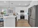 Modern white kitchen with stainless steel appliances and ample counter space at 2309 Seaseeker Ln., Myrtle Beach, SC 29577