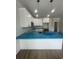 Modern kitchen featuring white cabinets, a breakfast bar, and stainless steel appliances at 2309 Seaseeker Ln., Myrtle Beach, SC 29577