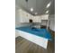 Modern kitchen featuring white cabinets, a breakfast bar, and stainless steel appliances at 2309 Seaseeker Ln., Myrtle Beach, SC 29577