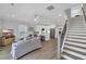 Cozy living room that flows into the open kitchen, with stairs nearby at 2309 Seaseeker Ln., Myrtle Beach, SC 29577