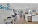 Open-concept living area with kitchen, dining, and living space and access to deck at 2309 Seaseeker Ln., Myrtle Beach, SC 29577