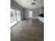 Bright living room with wood floors and sliding glass doors to the balcony at 2309 Seaseeker Ln., Myrtle Beach, SC 29577