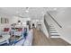 Open-concept living space with stairs and adjacent kitchen, dining area at 2309 Seaseeker Ln., Myrtle Beach, SC 29577