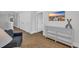Comfortable sitting area with console table, TV, jute rug, and access to other rooms at 2309 Seaseeker Ln., Myrtle Beach, SC 29577
