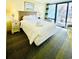 Comfortable bedroom with a queen bed and a balcony view to the outside at 2311 S Ocean Blvd. # 144, Myrtle Beach, SC 29577