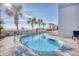 Outdoor pool area with palm trees, lounge chairs, and ocean views at 2311 S Ocean Blvd. # 144, Myrtle Beach, SC 29577
