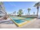 Shuffleboard courts available for residents to enjoy with palm trees in the background at 2311 S Ocean Blvd. # 144, Myrtle Beach, SC 29577