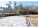 Paver patio surrounded by natural landscaping at 232 Ole Maple St., Loris, SC 29569