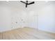 Bright bedroom boasts a ceiling fan, recessed lighting, and light wood-look flooring at 232 Ole Maple St., Loris, SC 29569