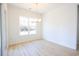 Spacious dining area featuring a stylish light fixture and light wood-look flooring at 232 Ole Maple St., Loris, SC 29569