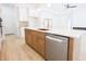 Open kitchen featuring an island, white countertops, modern appliances and wood accents at 232 Ole Maple St., Loris, SC 29569