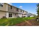 Townhome backyard features a well-kept lawn, white privacy fence, and exterior access with sliding glass doors at 247 Christiana Ln. # D, Myrtle Beach, SC 29579