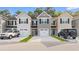 Charming townhomes with unique exteriors, driveways, and attached one-car garages at 247 Christiana Ln. # D, Myrtle Beach, SC 29579