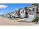 Street view of townhomes, each with attached one-car garages and driveways at 247 Christiana Ln. # D, Myrtle Beach, SC 29579
