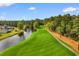 Scenic aerial view of a lush green golf course beside a pond and wooded area at 247 Christiana Ln. # D, Myrtle Beach, SC 29579