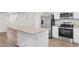 Modern kitchen featuring stainless steel appliances, granite countertops, and white cabinets at 247 Christiana Ln. # D, Myrtle Beach, SC 29579