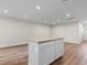 Modern kitchen island with granite countertop and white cabinets, bright recessed lighting at 247 Christiana Ln. # D, Myrtle Beach, SC 29579