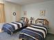 Comfortable bedroom showcases two twin beds with nautical-themed decor and striped bedding at 2507 S Ocean Blvd., North Myrtle Beach, SC 29582