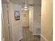 Inviting hallway with tiled floor, wainscoting, and decorative wall art at 2507 S Ocean Blvd., North Myrtle Beach, SC 29582