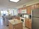 A bright kitchen with island, granite counters and stainless steel appliances at 2507 S Ocean Blvd., North Myrtle Beach, SC 29582