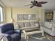 Comfortable living room with plush seating, ceiling fan and water view at 2507 S Ocean Blvd., North Myrtle Beach, SC 29582