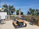 Outdoor picnic table and beach chairs sit on the pool deck beneath the sunny sky at 2507 S Ocean Blvd., North Myrtle Beach, SC 29582