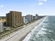 Aerial view of a high-rise beachfront resort with sandy beach, ocean, and surrounding buildings at 2600 N Ocean Blvd. # 807, Myrtle Beach, SC 29577