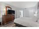Relaxing bedroom featuring a king-size bed and an ensuite bathroom entrance at 2600 N Ocean Blvd. # 807, Myrtle Beach, SC 29577