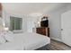 Spacious bedroom with a large TV on a dresser, a window with curtains, and a cozy bed at 2600 N Ocean Blvd. # 807, Myrtle Beach, SC 29577
