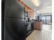 Well-equipped kitchen with black appliances and wooden cabinets, ready for culinary adventures at 2600 N Ocean Blvd. # 807, Myrtle Beach, SC 29577