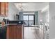 Cozy kitchen with sleek countertops, essential appliances, and an adjacent living area with ocean view balcony at 2600 N Ocean Blvd. # 807, Myrtle Beach, SC 29577