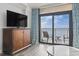 Bright living room with modern tv, and a balcony with ocean views at 2600 N Ocean Blvd. # 807, Myrtle Beach, SC 29577