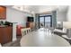 Open-concept living and dining area featuring a TV, ocean view balcony, and seating for a gathering at 2600 N Ocean Blvd. # 807, Myrtle Beach, SC 29577