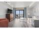 Inviting living room with comfortable seating, TV, and balcony offering ocean views at 2600 N Ocean Blvd. # 807, Myrtle Beach, SC 29577